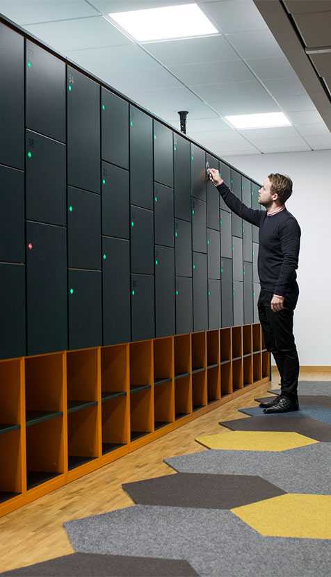 Man using Martela Dynamic Storage at Cybercom's office in Stockholm