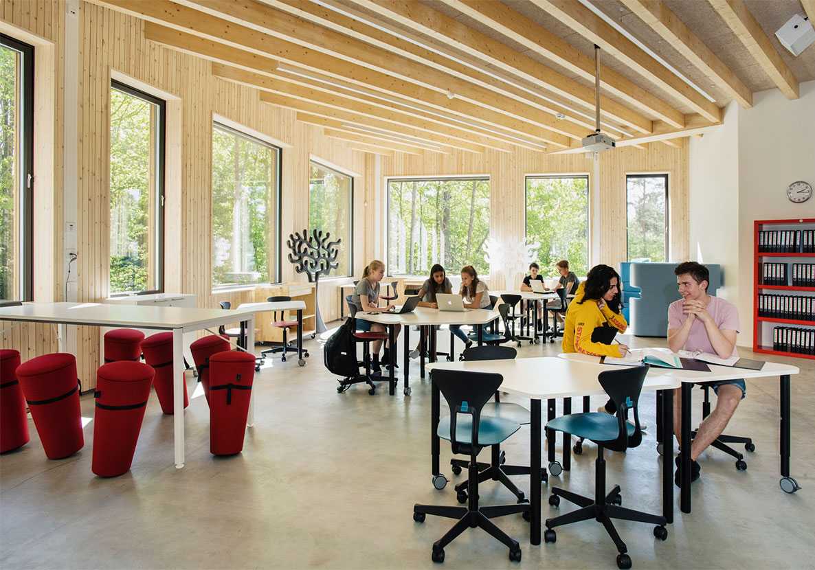 Students studying on Martela's Salmiakki tables at Drøbak Montessori School in Norway