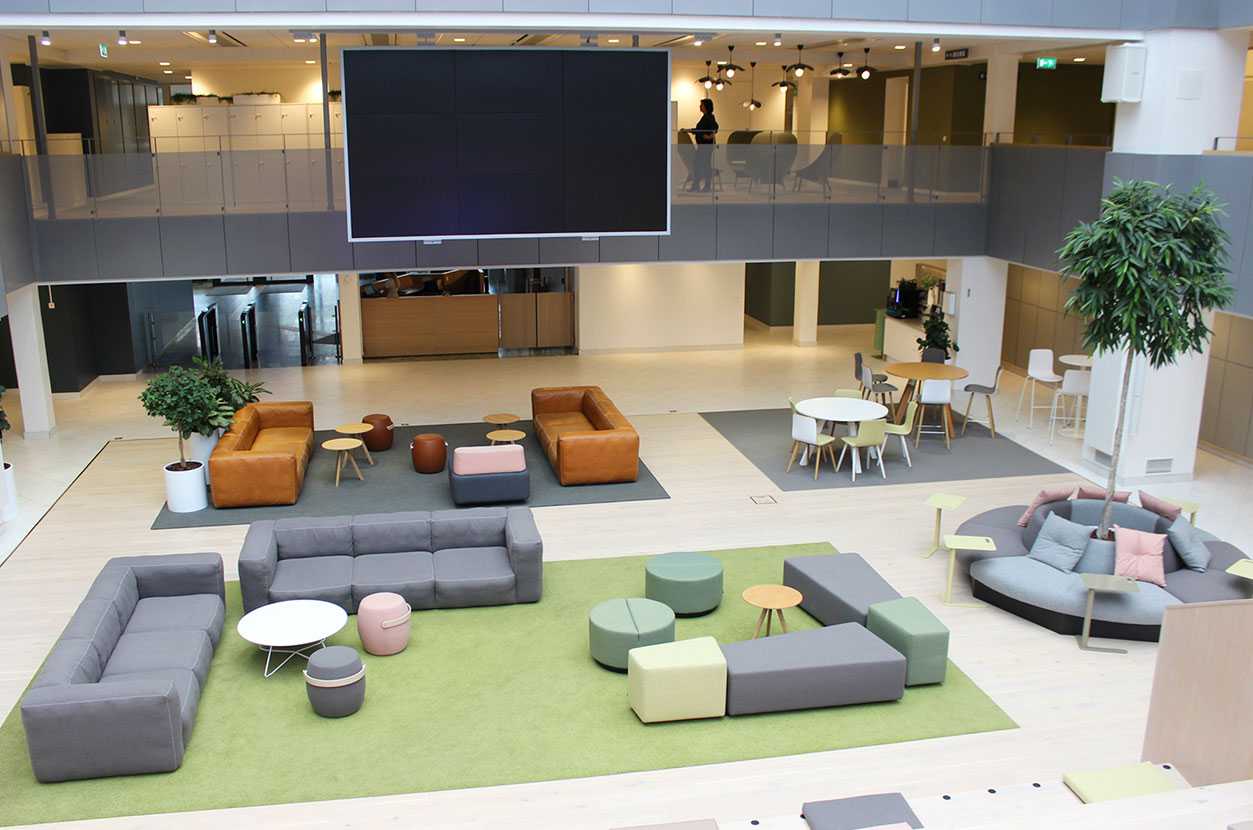 Martela's Diagonal Play and Movie benches and Scoop tables at EVRY's head office in Solna, Stockholm