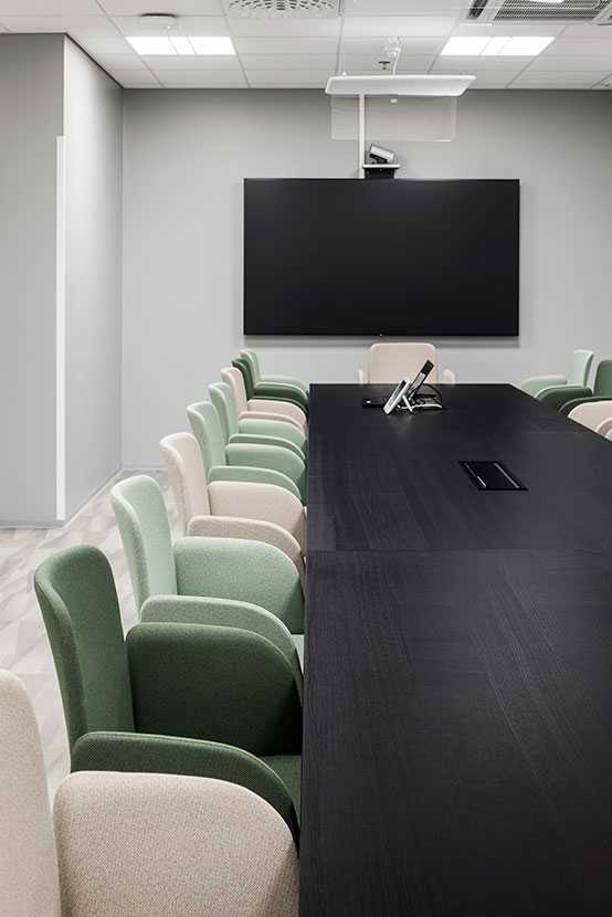 A long conference table and conference chairs