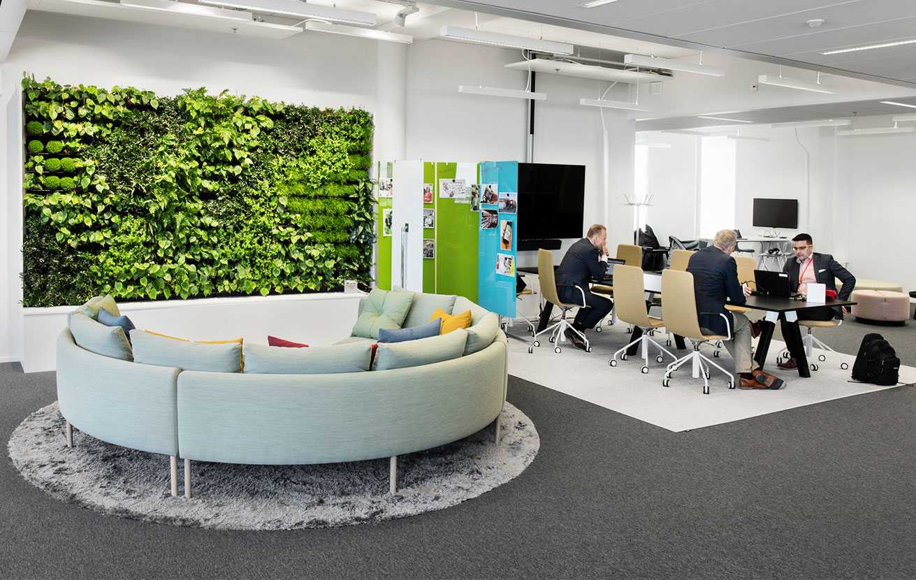 Martela's Nooa sofa, Sola chairs and Frankie table at Solteq's office in Vantaa, Finland
