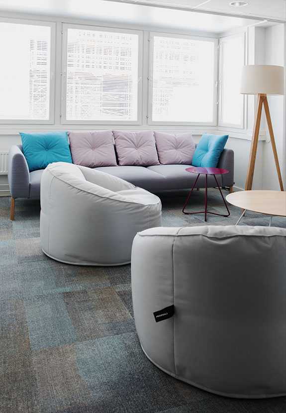 Martela's Nooa sofa and Scoop tables at FELM's office in Helsinki, Finland