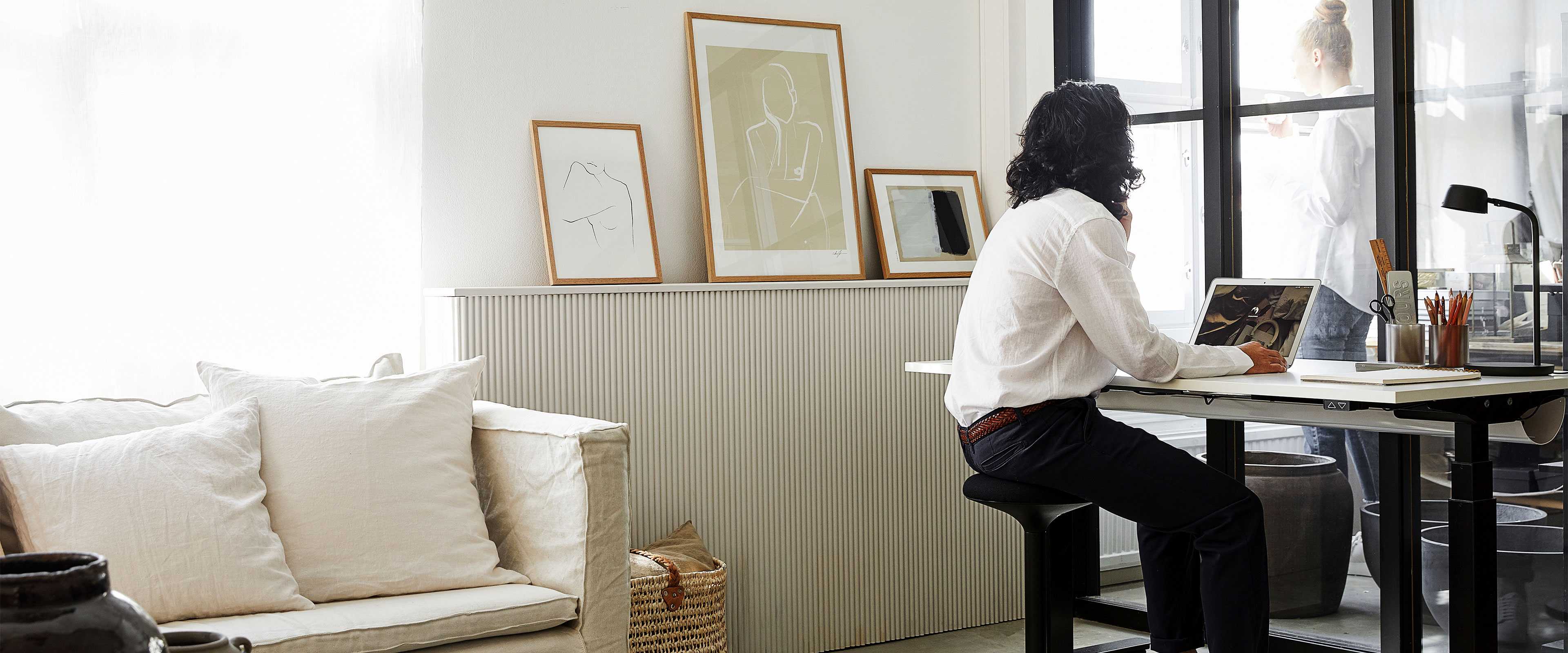 A man at a desk in a home office