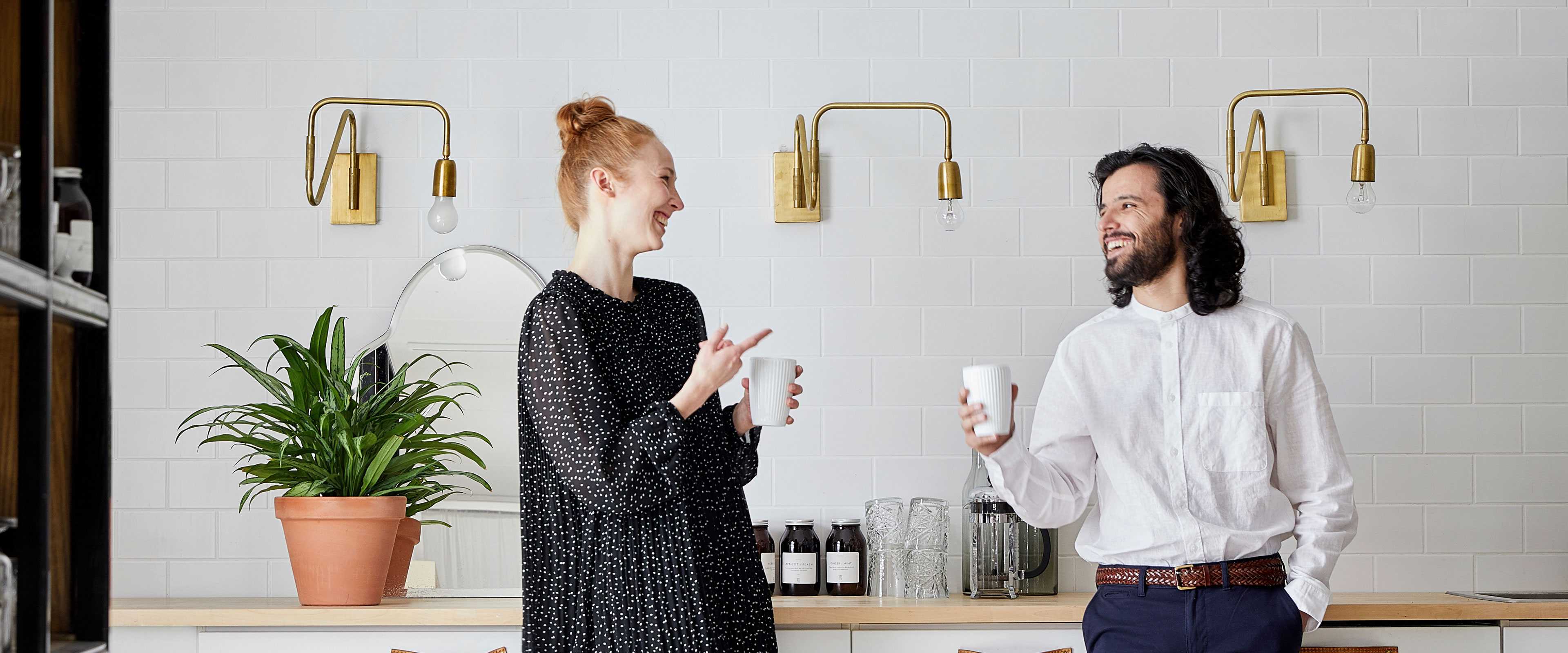 Two people with coffee cups