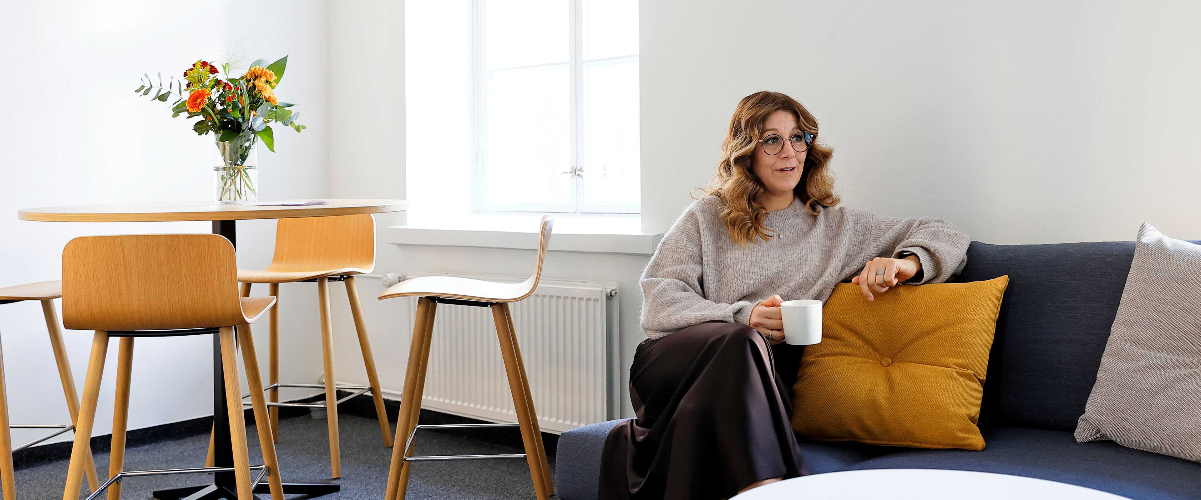 Woman with a coffee cup in hand