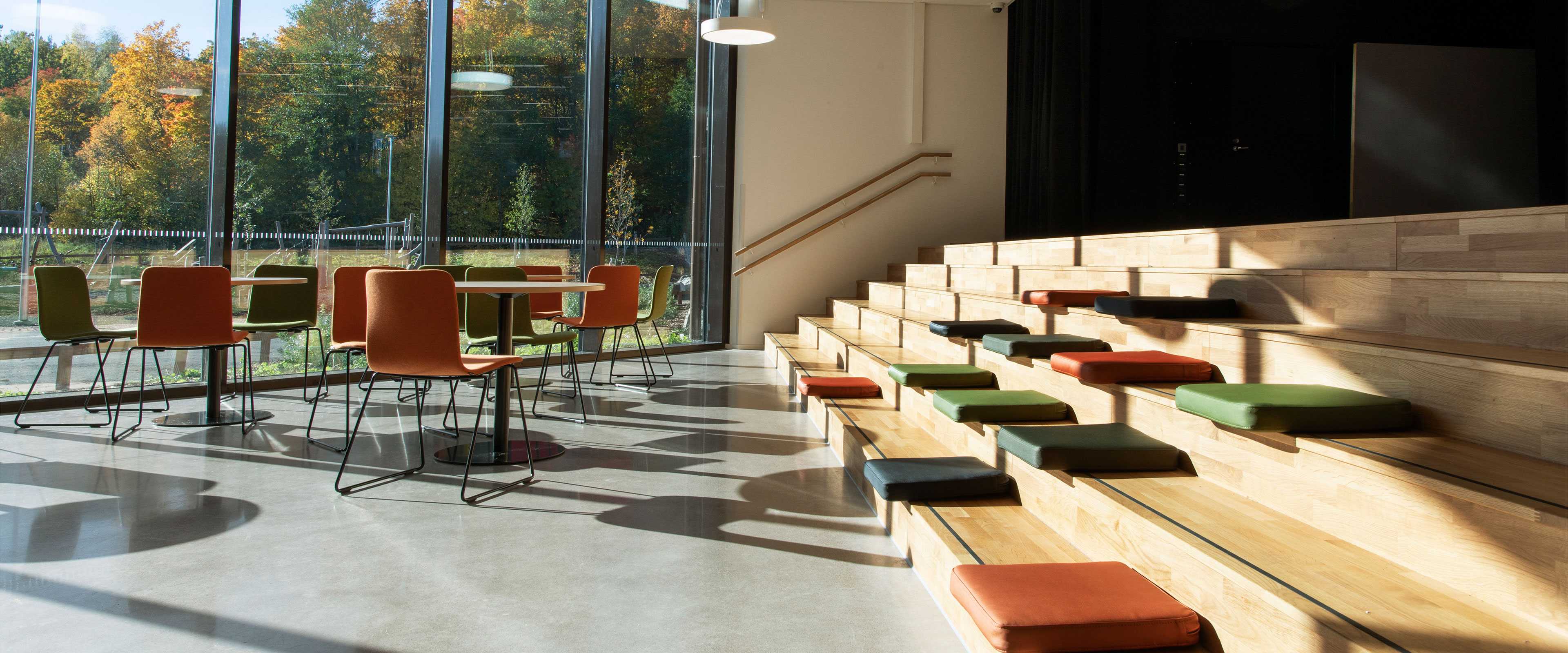 Martela's Sola chairs, Spot tables and Puffet seat cushions at Syvälahti Community Centre in Turku, Finland