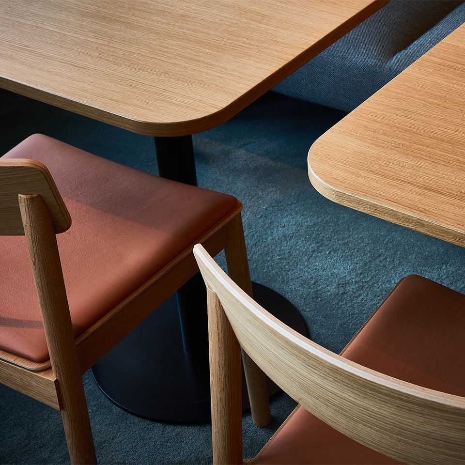 A close-up of the wooden tables and chairs