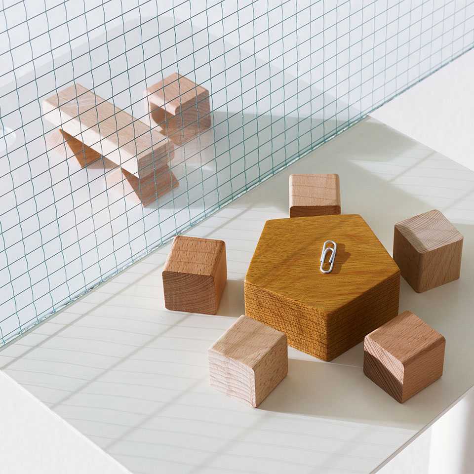 Wooden blocks composed as groups of tables