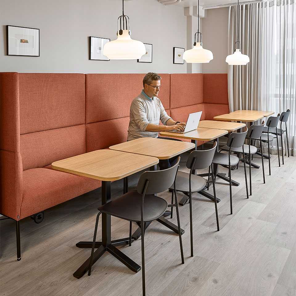 Man working at a working cafe